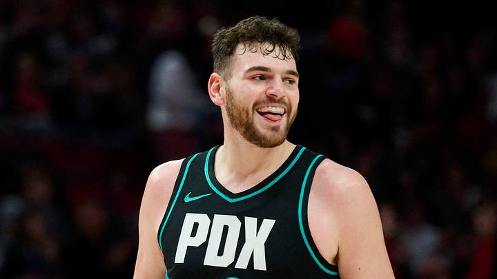 Jan 5, 2026; Portland, Oregon, USA; Portland Trail Blazers center Donovan Clingan (23) celebrates after scoring a three point basket during the first half against the Utah Jazz at Moda Center. Mandatory Credit: Troy Wayrynen-Imagn Images Jan 5, 2026; Portland, Oregon, USA; Portland Trail Blazers center Donovan Clingan (23) celebrates after scoring a three point basket during the first half against the Utah Jazz at Moda Center. Mandatory Credit: Troy Wayrynen-Imagn Images