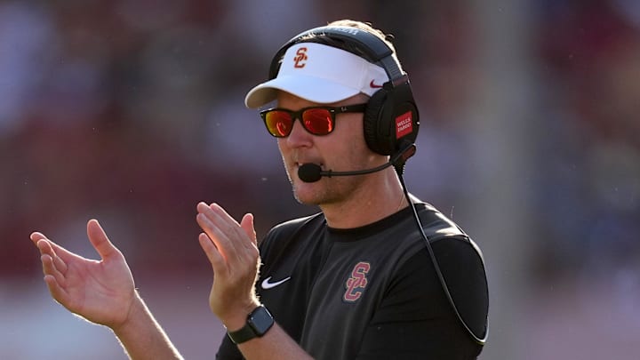 Aug 30, 2025; Los Angeles, California, USA; Southern California Trojans head coach Lincoln Riley watches from the sidelines against the Missouri State Bears in the first half at United Airlines Field at Los Angeles Memorial Coliseum. Mandatory Credit: Kirby Lee-Imagn Images