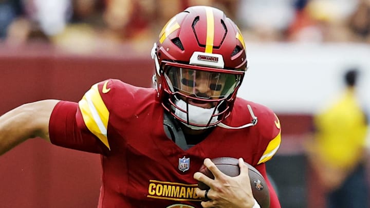 Sep 21, 2025; Landover, Maryland, USA; Washington Commanders quarterback Marcus Mariota (8) runs the ball during the first half against the Las Vegas Raiders at Northwest Stadium. Mandatory Credit: Geoff Burke-Imagn Images