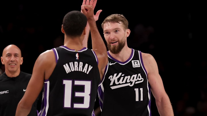 Jan 27, 2025; Brooklyn, New York, USA; Sacramento Kings forward Domantas Sabonis (11) celebrates his three point shot against the Brooklyn Nets with forward Keegan Murray (13) during the fourth quarter at Barclays Center.