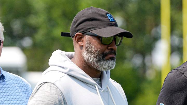 From left, Detroit Lions team president and CEO Rod Wood, general manager Brad Holmes, and head coach Dan Campbell walk off the field after practice during training camp at Meijer Performance Center in Allen Park on Monday, August 10, 2026.