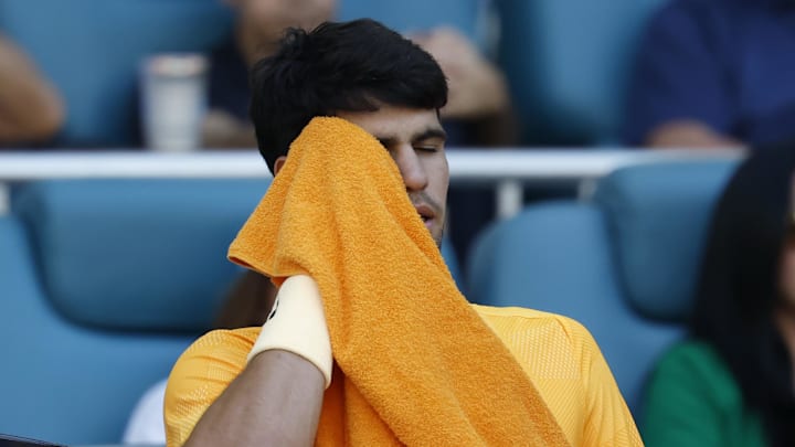 Carlos Alcaraz wipes his face Carlos Alcaraz wipes his face