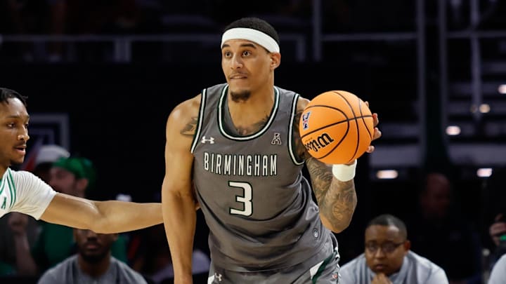Mar 15, 2025; Fort Worth, TX, USA;  UAB Blazers forward Yaxel Lendeborg (3) looks to pass against North Texas Mean Green forward Grant Newell (8) during the first half at Dickies Arena. Mandatory Credit: Chris Jones-Imagn Images