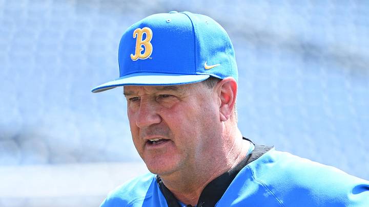 Jun 14, 2025; Omaha, Neb, USA;  UCLA Bruins head coach John Savage on the field before the game against the Murray State Races at Charles Schwab Field. Mandatory Credit: Steven Branscombe-Imagn Images