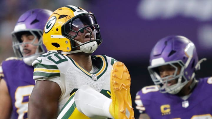 Green Bay Packers defensive end Barryn Sorrell (99) celebrates after tackliing Minnesota Vikings running back Ty Chandler.