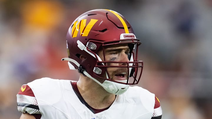 Washington Commanders tight end Zach Ertz reacts against the Arizona Cardinals.