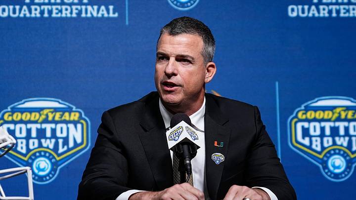 Miami (FL) Hurricanes head coach Mario Cristobal talks to media during a Cotton Bowl press conference at AT&T Stadium in Arlington, Texas prior to their College Football Playoff quarterfinal matchup on Dec. 30, 2025.
