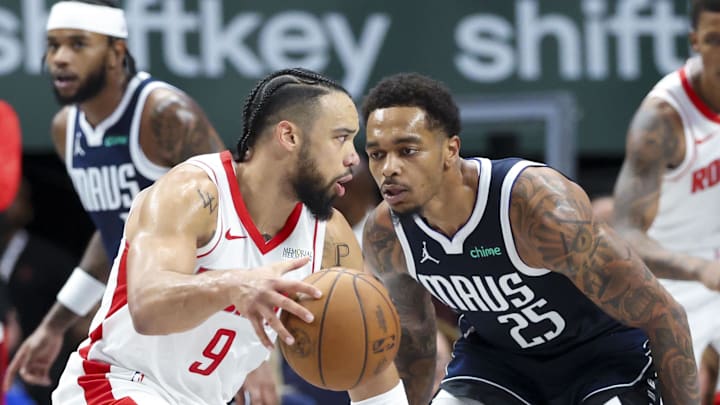 Oct 31, 2024; Dallas, Texas, USA;  Houston Rockets forward Dillon Brooks (9) controls the ball as Dallas Mavericks forward P.J. Washington (25) defends during the second half at American Airlines Center. Mandatory Credit: Kevin Jairaj-Imagn Images