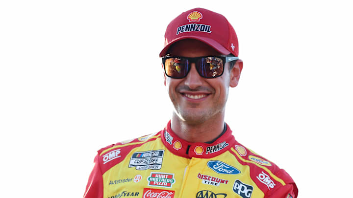 Aug 16, 2025; Richmond, Virginia, USA; NASCAR Cup Series driver Joey Logano (22) smiles during driver introductions prior to the NASCAR Cup Series Cook Out 400 at Richmond Raceway. Mandatory Credit: Amber Searls-Imagn Images