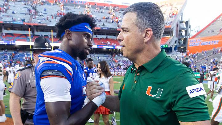 Miami Hurricanes head coach Mario Cristobal shakes hands with Florida Gators defensive back Trikweze Bridges (7) after Hurricanes defeated the Gators during the season opener at Ben Hill Griffin Stadium in Gainesville, FL on Saturday, August 31, 2024 against the University of Miami Hurricanes. The Hurricanes defeated the Gators 41-17. [Doug Engle/Gainesville Sun]