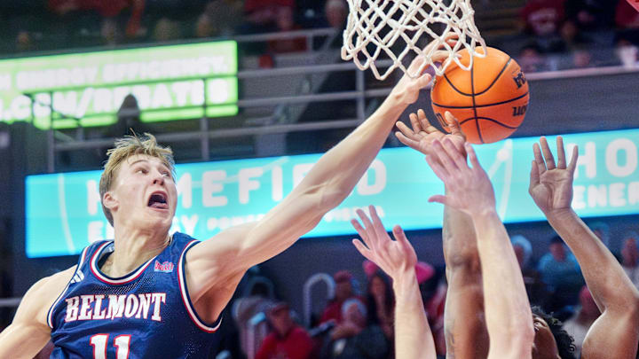 Belmont's Drew Scharnowski (11) blocks a shot by Bradley's Jaquan Johnson in the second half of their college basketball game Monday, Feb. 9, 2026 at Carver Arena in Peoria. Johnson was fouled before the block. The Braves defeated the Bruins 95-84.