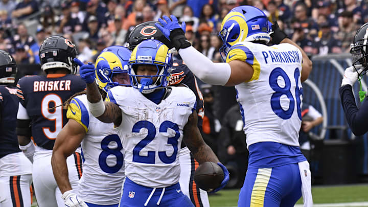 Sep 29, 2024; Chicago, Illinois, USA;  Los Angeles Rams running back Kyren Williams (23) celebrates with tight end Colby Parkinson (86) after he scores a touchdown against the Chicago Bears during the second half at Soldier Field.