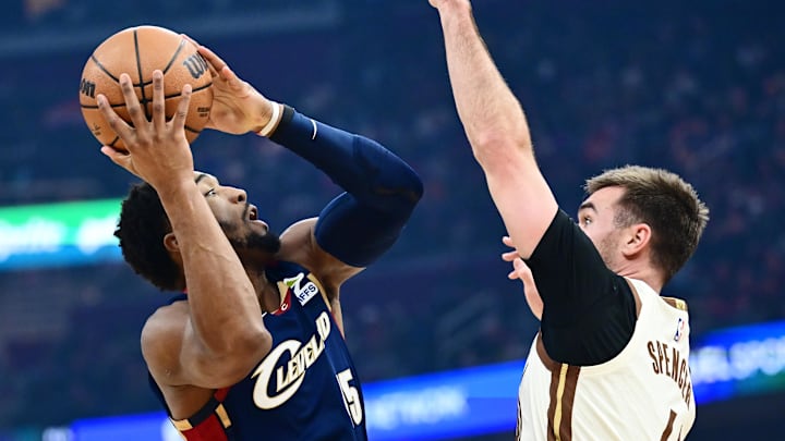 Dec 6, 2025; Cleveland, Ohio, USA; Cleveland Cavaliers guard Donovan Mitchell (45) drives to the basket against Golden State Warriors guard Pat Spencer (61) during the first quarter at Rocket Arena. Mandatory Credit: Ken Blaze-Imagn Images Dec 6, 2025; Cleveland, Ohio, USA; Cleveland Cavaliers guard Donovan Mitchell (45) drives to the basket against Golden State Warriors guard Pat Spencer (61) during the first quarter at Rocket Arena. Mandatory Credit: Ken Blaze-Imagn Images