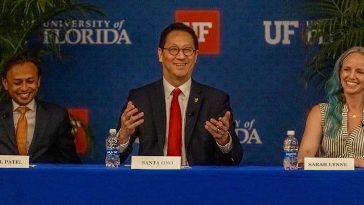 University of Florida faculty members listen to Dr. Santa Ono, center, the sole finalist for the university's president, along with Rahul Patel, left, and Sarah Lynne during a forum on May 6, 2025, at Emerson Alumni Hall in Gainesville.