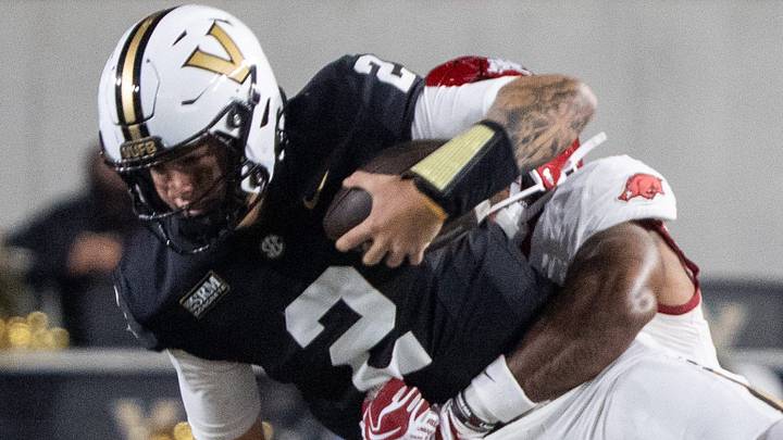 Vanderbilt Commodores quarterback Jared Curtis (2) is tackled by Arkansas Razorbacks linebacker Phoenix Jackson (8) during the game between Vanderbilt and Arkansas at FirstBank Stadium in Nashville on Saturday, Oct. 17, 2026. Vanderbilt Commodores quarterback Jared Curtis (2) is tackled by Arkansas Razorbacks linebacker Phoenix Jackson (8) during the game between Vanderbilt and Arkansas at FirstBank Stadium in Nashville on Saturday, Oct. 17, 2026.