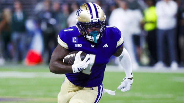 Aug 30, 2025; Seattle, Washington, USA; Washington Huskies running back Jonah Coleman (1) rushes for a touchdown against the Colorado State Rams during the first quarter at Husky Stadium. 
