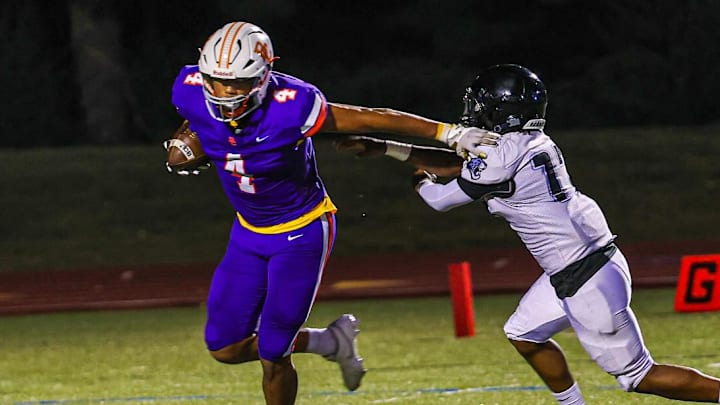 2026 prospect Demeterius Thompson (4) sheds a tackler on a rush attempt. 