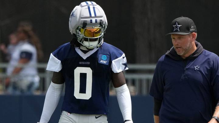Dallas Cowboys linebacker DeMarvion Overshown talks with inside linebackers coach Scott Symons