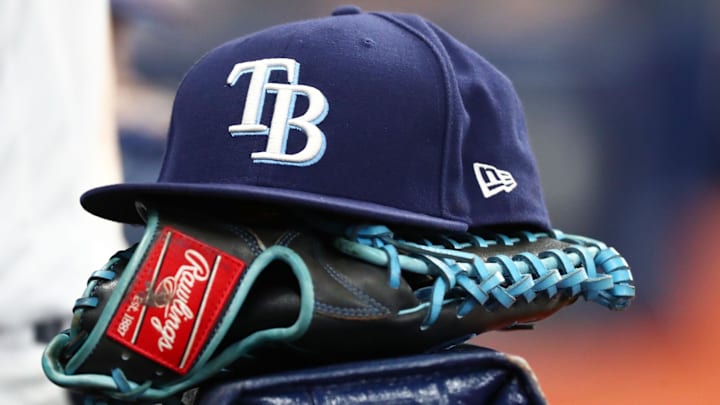 Sep 6, 2019; St. Petersburg, FL, USA; A detail view of a Tampa Bay Rays hat and glove at Tropicana Field. 