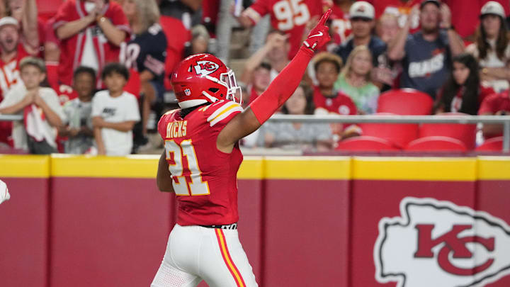Aug 22, 2024; Kansas City, Missouri, USA; Kansas City Chiefs safety Jaden Hicks (21) celebrates against the Chicago Bears after recovering a fumble during the first half at GEHA Field at Arrowhead Stadium. Mandatory Credit: Denny Medley-Imagn Images