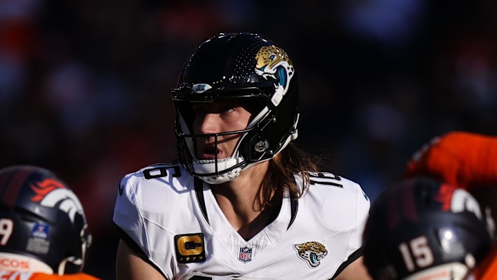 Dec 21, 2025; Denver, Colorado, USA; Jacksonville Jaguars quarterback Trevor Lawrence (16) drops back to pass against the Denver Broncos during the first half  at Empower Field at Mile High. Mandatory Credit: Ron Chenoy-Imagn Images