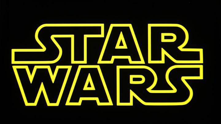 In this photo illustration, a Star Wars logo is seen on a...