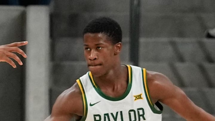 Jan 19, 2025; Waco, Texas, USA;  Baylor Bears guard VJ Edgecombe (7) celebrates with Baylor Bears guard Jeremy Roach (3) after a play against the TCU Horned Frogs during the first half at Paul and Alejandra Foster Pavilion. Mandatory Credit: Chris Jones-Imagn Images