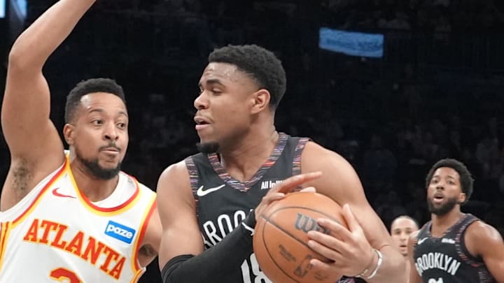 Apr 3, 2026; Brooklyn, New York, USA; Brooklyn Nets guard Malachi Smith (18) drives the ball against Atlanta Hawks guard CJ McCollum (3) during the first half at Barclays Center. Mandatory Credit: Gregory Fisher-Imagn Images