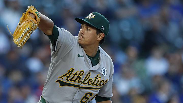 Jun 2, 2026; Chicago, Illinois, USA; Athletics starting pitcher Gage Jump (61) delivers a pitch against the Chicago Cubs during the first inning at Wrigley Field. Mandatory Credit: Kamil Krzaczynski-Imagn Images