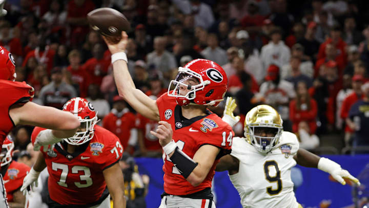 Jan 2, 2025; New Orleans, LA, USA; Georgia Bulldogs quarterback Gunner Stockton (14) throws a pass during the second quarter against the Notre Dame Fighting Irish at Caesars Superdome. Mandatory Credit: Amber Searls-Imagn Images Jan 2, 2025; New Orleans, LA, USA; Georgia Bulldogs quarterback Gunner Stockton (14) throws a pass during the second quarter against the Notre Dame Fighting Irish at Caesars Superdome. Mandatory Credit: Amber Searls-Imagn Images