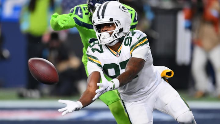 Green Bay Packers wide receiver Romeo Doubs (87) catches a pass for a touchdown while covered by Seattle Seahawks cornerback Devon Witherspoon (21) during the second half at Lumen Field.