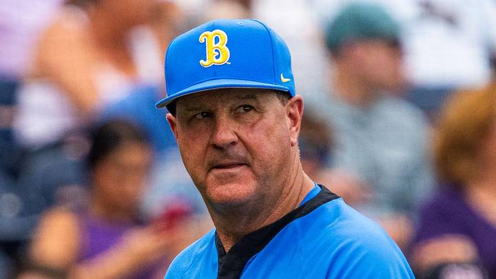 Jun 16, 2025; Omaha, Neb, USA; UCLA Bruins head coach John Savage walks off the field before the game against the LSU Tigers at Charles Schwab Field. Mandatory Credit: Dylan Widger-Imagn Images Jun 16, 2025; Omaha, Neb, USA; UCLA Bruins head coach John Savage walks off the field before the game against the LSU Tigers at Charles Schwab Field. Mandatory Credit: Dylan Widger-Imagn Images