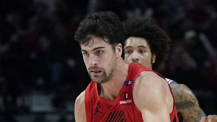 Portland Trail Blazers small forward Deni Avdija dribbles the ball past Philadelphia 76ers forward Guerschon Yabusele.