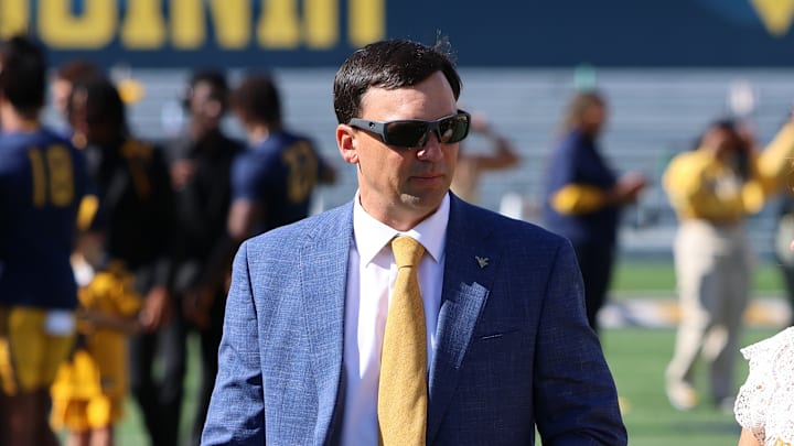 West Virginia University head coach Neal Brown with his wife Brooke. West Virginia University head coach Neal Brown with his wife Brooke.