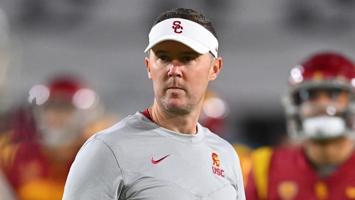 Oct 1, 2022; Los Angeles, California, USA;  USC Trojans head coach Lincoln Riley walks on the field before a game against the Arizona State Sun Devils at United Airlines Field at the Los Angeles Memorial Coliseum. Mandatory Credit: Jayne Kamin-Oncea-Imagn Images