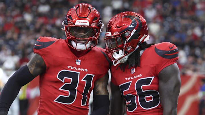 Former Houston Texans linebacker Damone Clark (31) and linebacker Jamal Hill (56) against Las Vegas Raiders