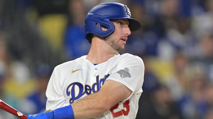 Mar 27, 2026; Los Angeles, California, USA; Los Angeles Dodgers right fielder Kyle Tucker (23) hits an RBI single against the Arizona Diamondbacks in the eighth inning at Dodger Stadium. Mandatory Credit: Jayne Kamin-Oncea-Imagn Images