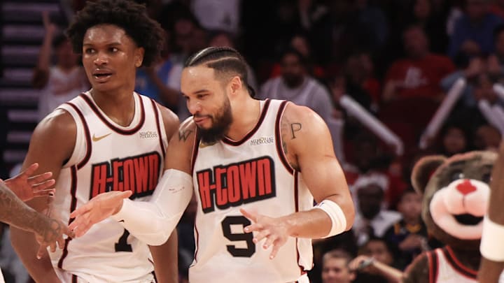 Feb 12, 2025; Houston, Texas, USA; Houston Rockets guard Jalen Green (4) and forward Amen Thompson (1) celebrate with forward Dillon Brooks (9) after a three point basket against the Phoenix Suns in the second half at Toyota Center. Mandatory Credit: Thomas Shea-Imagn Images
