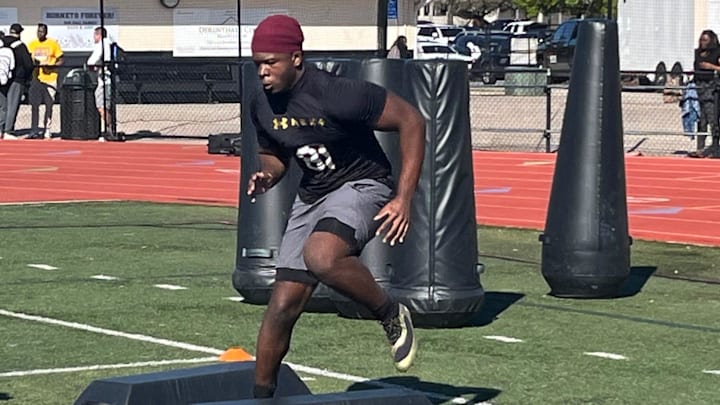 Cardinal Mooney defensive lineman Elijah Golden, shown going through in individual drills during the Under Armour Next camp, has committed to Notre Dame.