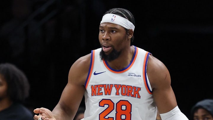 Nov 24, 2025; Brooklyn, New York, USA; New York Knicks forward Guerschon Yabusele (28) reacts in front of Brooklyn Nets guard Tyrese Martin (13) during the second half at Barclays Center. Mandatory Credit: Vincent Carchietta-Imagn Images