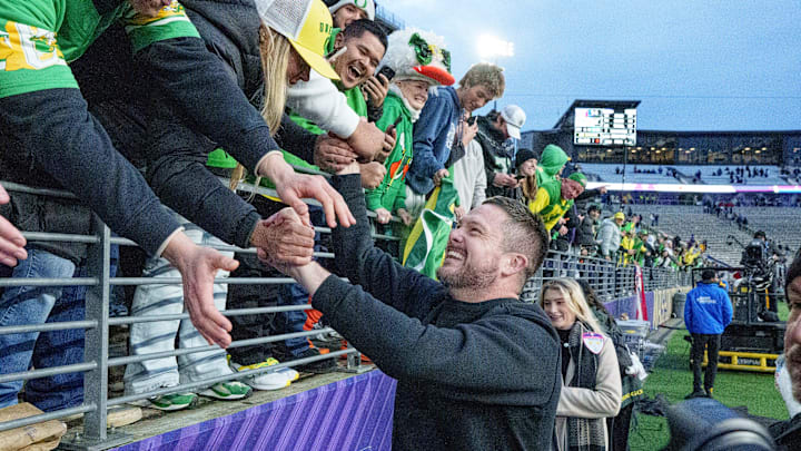 Oregon head coach Dan Lanning celebrates with post game as the Oregon Ducks take on the Washington Huskies on Nov. 29, 2025, at Husky Stadium in Seattle, Washington.