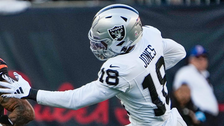 Cincinnati Bengals running back Chase Brown (30) tries to run pass Las Vegas Raiders cornerback Jack Jones (18) in the 4th quarter at Paycor Stadium Sunday, November 3, 2024. The Bengals won 41-24. Cincinnati Bengals running back Chase Brown (30) tries to run pass Las Vegas Raiders cornerback Jack Jones (18) in the 4th quarter at Paycor Stadium Sunday, November 3, 2024. The Bengals won 41-24.