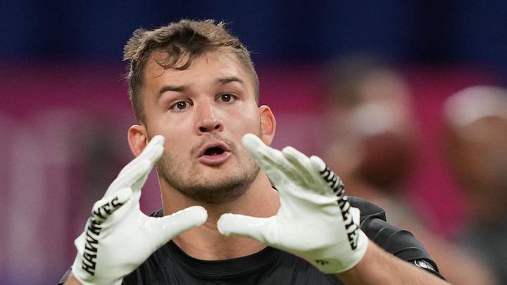 Iowa tight end Luke Lachey (TE14) participates in drills during the 2025 NFL Combine at Lucas Oil Stadium. 