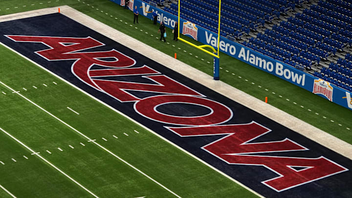 The Arizona Wildcats logo in the end zone