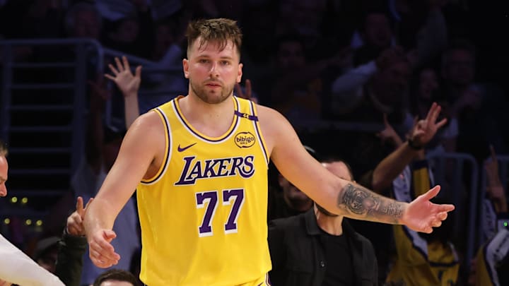 Feb 27, 2025; Los Angeles, California, USA; Los Angeles Lakers guard Luka Doncic (77) reacts after making a basket during the fourth quarter against the Minnesota Timberwolves at Crypto.com Arena. Mandatory Credit: Jason Parkhurst-Imagn Images