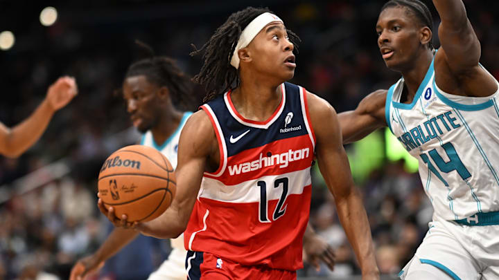Oct 26, 2025; Washington, District of Columbia, USA; Washington Wizards guard Tre Johnson (12) drives the basket in front to Charlotte Hornets forward Moussa Diabate (14) during the first quarter at Capital One Arena. Mandatory Credit: Rafael Suanes-Imagn Images Oct 26, 2025; Washington, District of Columbia, USA; Washington Wizards guard Tre Johnson (12) drives the basket in front to Charlotte Hornets forward Moussa Diabate (14) during the first quarter at Capital One Arena. Mandatory Credit: Rafael Suanes-Imagn Images