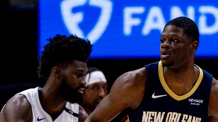 New Orleans Pelicans center Mo Bamba dribbles against Orlando Magic forward Jonathan Isaac.