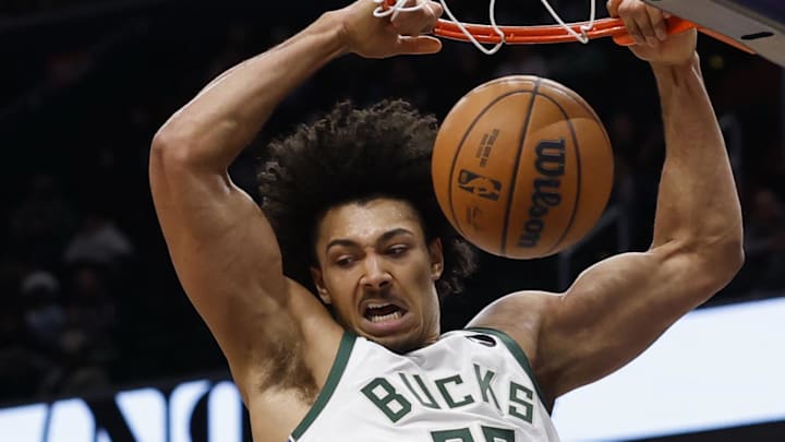 Milwaukee Bucks center Jericho Sims (00) dunks the ball as Washington Wizards forward Justin Champagnie (9) looks on in the second quarter at Capital One Arena. Dec 1, 2025. Milwaukee Bucks center Jericho Sims (00) dunks the ball as Washington Wizards forward Justin Champagnie (9) looks on in the second quarter at Capital One Arena. Dec 1, 2025.