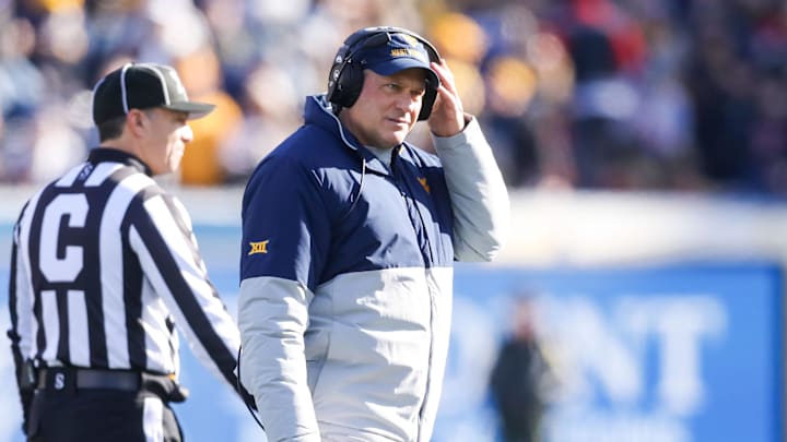 Nov 29, 2025; Morgantown, West Virginia, USA; West Virginia Mountaineers head coach Rich Rodriguez walks off the field after questioning a call with a referee during the first quarter against the Texas Tech Red Raiders at Milan Puskar Stadium. Mandatory Credit: Ben Queen-Imagn Images Nov 29, 2025; Morgantown, West Virginia, USA; West Virginia Mountaineers head coach Rich Rodriguez walks off the field after questioning a call with a referee during the first quarter against the Texas Tech Red Raiders at Milan Puskar Stadium. Mandatory Credit: Ben Queen-Imagn Images