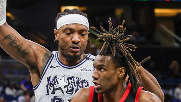 Toronto Raptors guard Ja'Kobe Walter drives around Orlando Magic center Wendell Carter Jr. Toronto Raptors guard Ja'Kobe Walter drives around Orlando Magic center Wendell Carter Jr.